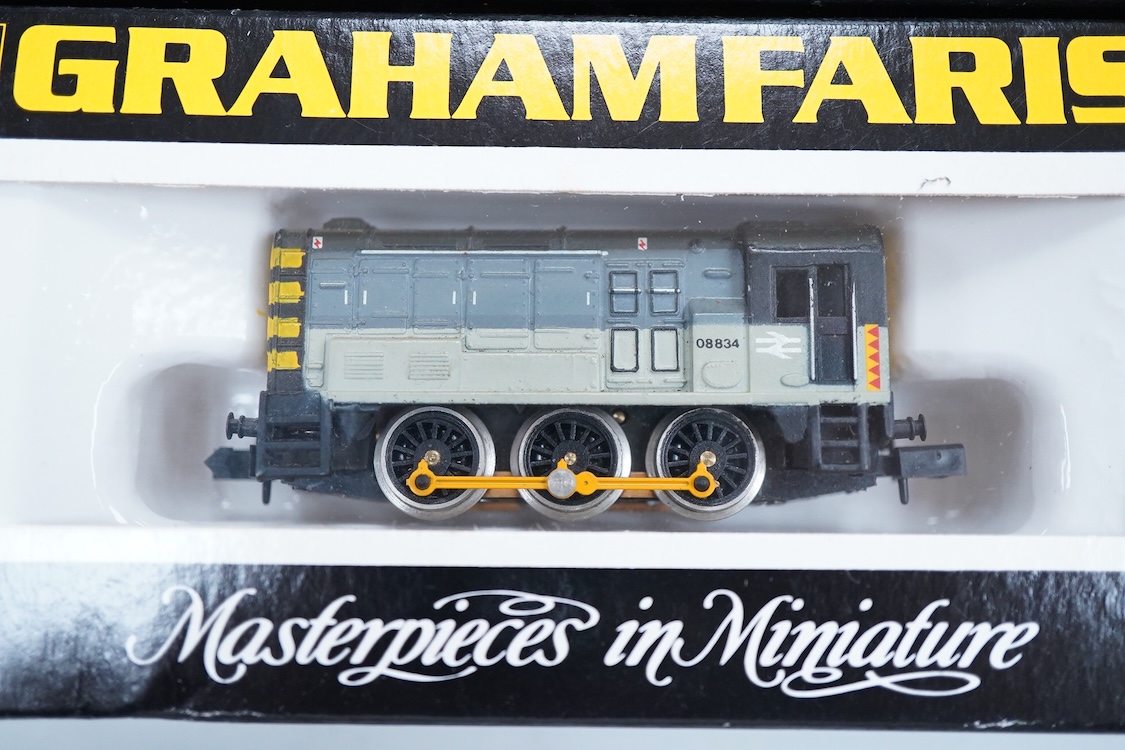 Four boxed Graham Farish N gauge railway Class 08 0-6-0 diesel locomotives; a BR, D3729 (371-001), a BR Railfreight, 08 834 (1008), an EWS, 08921 (100G) and a Thomas 1, 08500 (1006).
